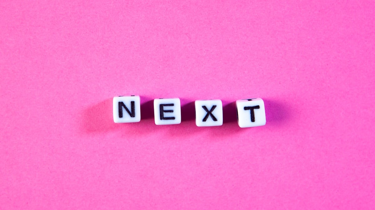 word new exit on an abstract pink background, business and finance concept